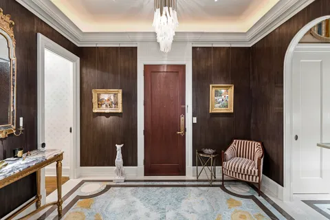 a living room with fireplace furniture and a flat screen tv