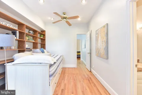 a hallway with a washer and dryer