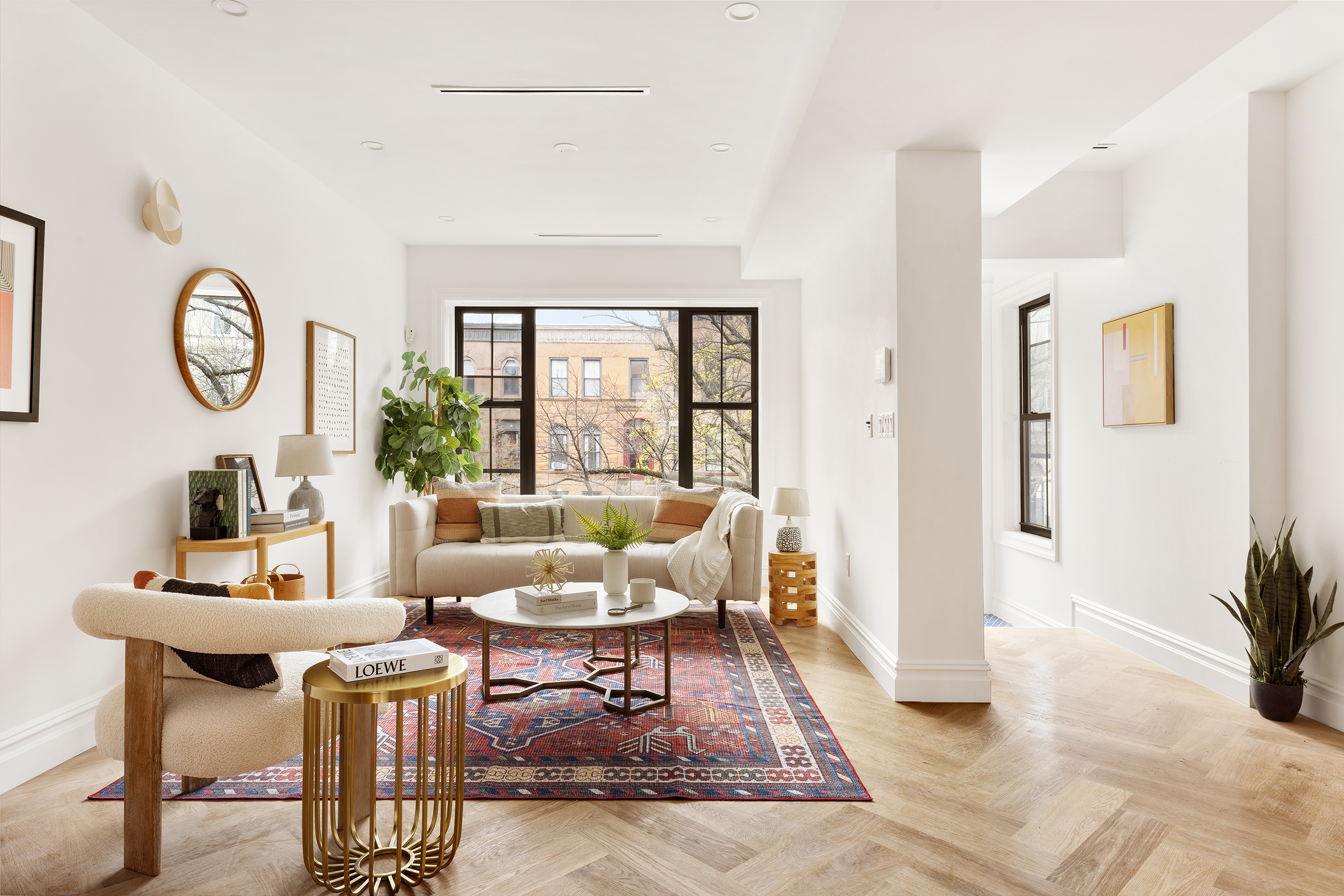 a living room with furniture and wooden floor