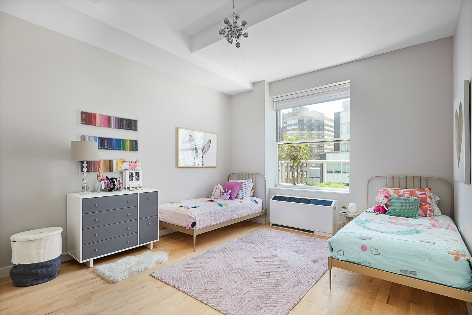 15 Broad Street, Unit 2416 Manhattan, NY 10005 - Photo 6 of 25 a bedroom with a bed and wooden floor