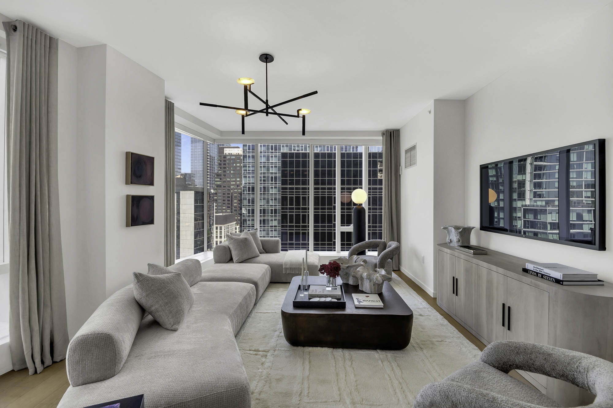 1 West End Avenue, Unit 10A Manhattan, NY 10023 - Photo 3 of 38 a living room with furniture and a large window