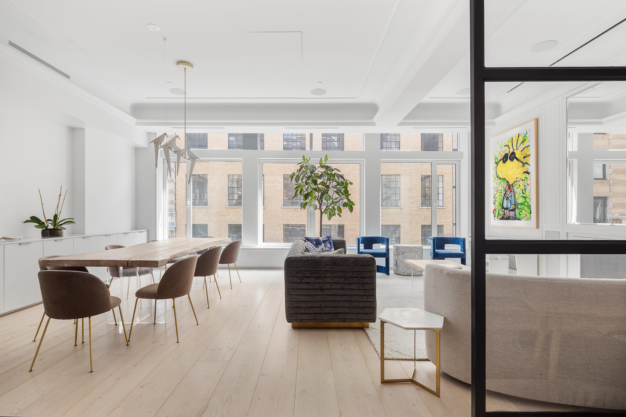 26 West 20th Street, Unit 3 Manhattan, NY 10011 - Photo 5 of 19 a living room with furniture a wooden floor and a chandelier