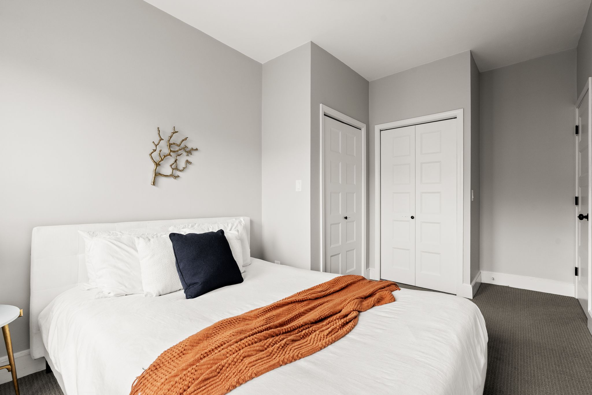 88 Hancock Street, Unit 17 Cambridge, MA 02139 - Photo 11 of 18 a bedroom with a bed and a painting on the wall