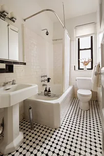 a view of a hallway with a black white checkered floor