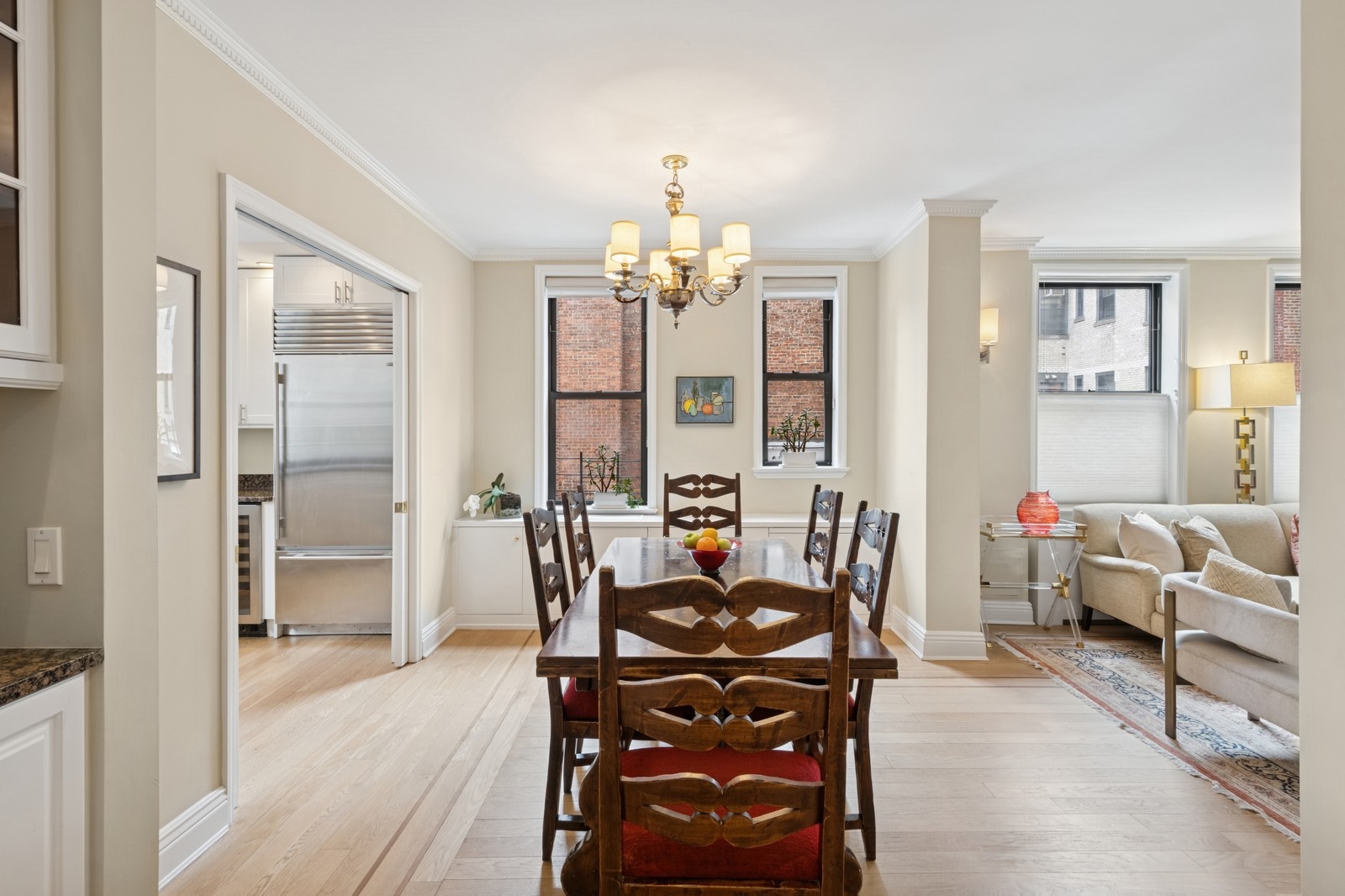 514 West End Avenue, Unit 8/9A Manhattan, NY 10024 - Photo 6 of 24 a view of a dining room with furniture and chandelier