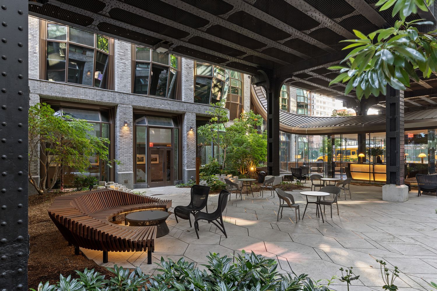 515 West 18th Street, Unit 901 Manhattan, NY 10011 - Photo 11 of 14 a view of a patio with table and chairs potted plants and floor to ceiling window