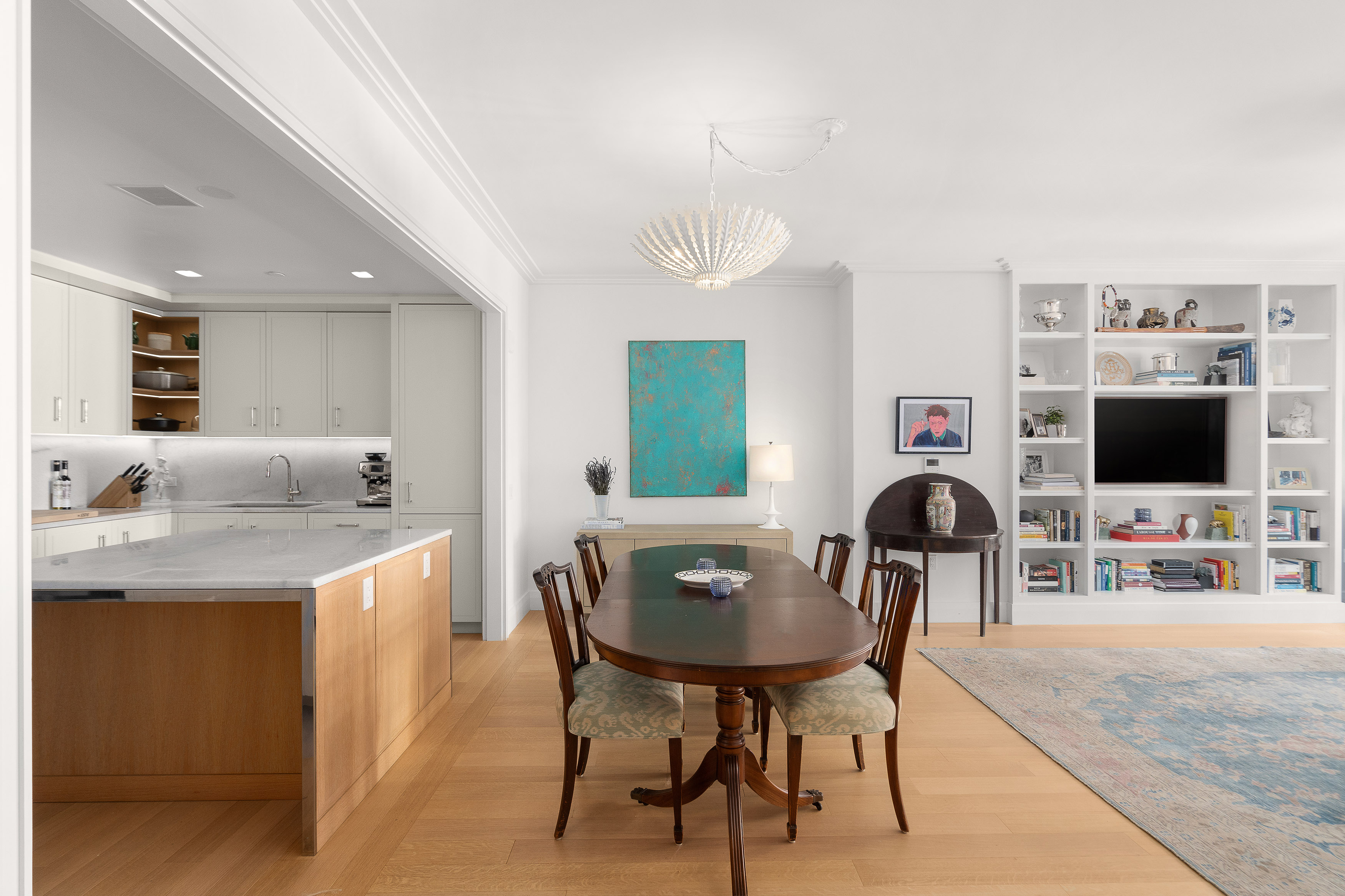 200 East 83rd Street, Unit 4E Manhattan, NY 10028 - Photo 3 of 29 a living room with furniture and a flat screen tv