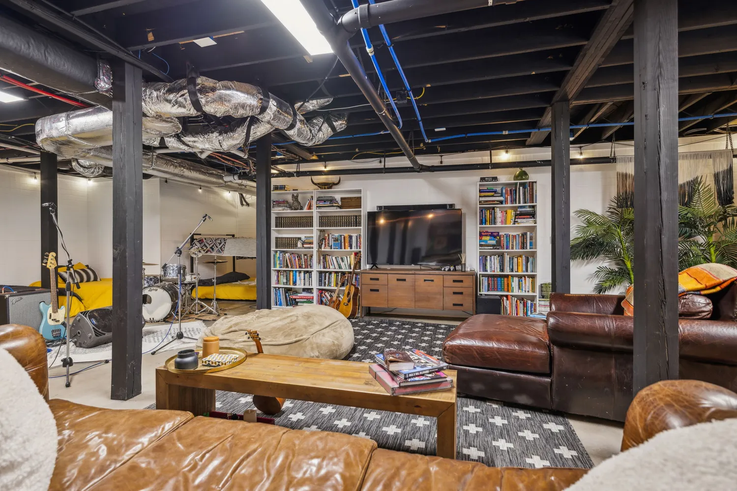 a living room with furniture and a flat screen tv