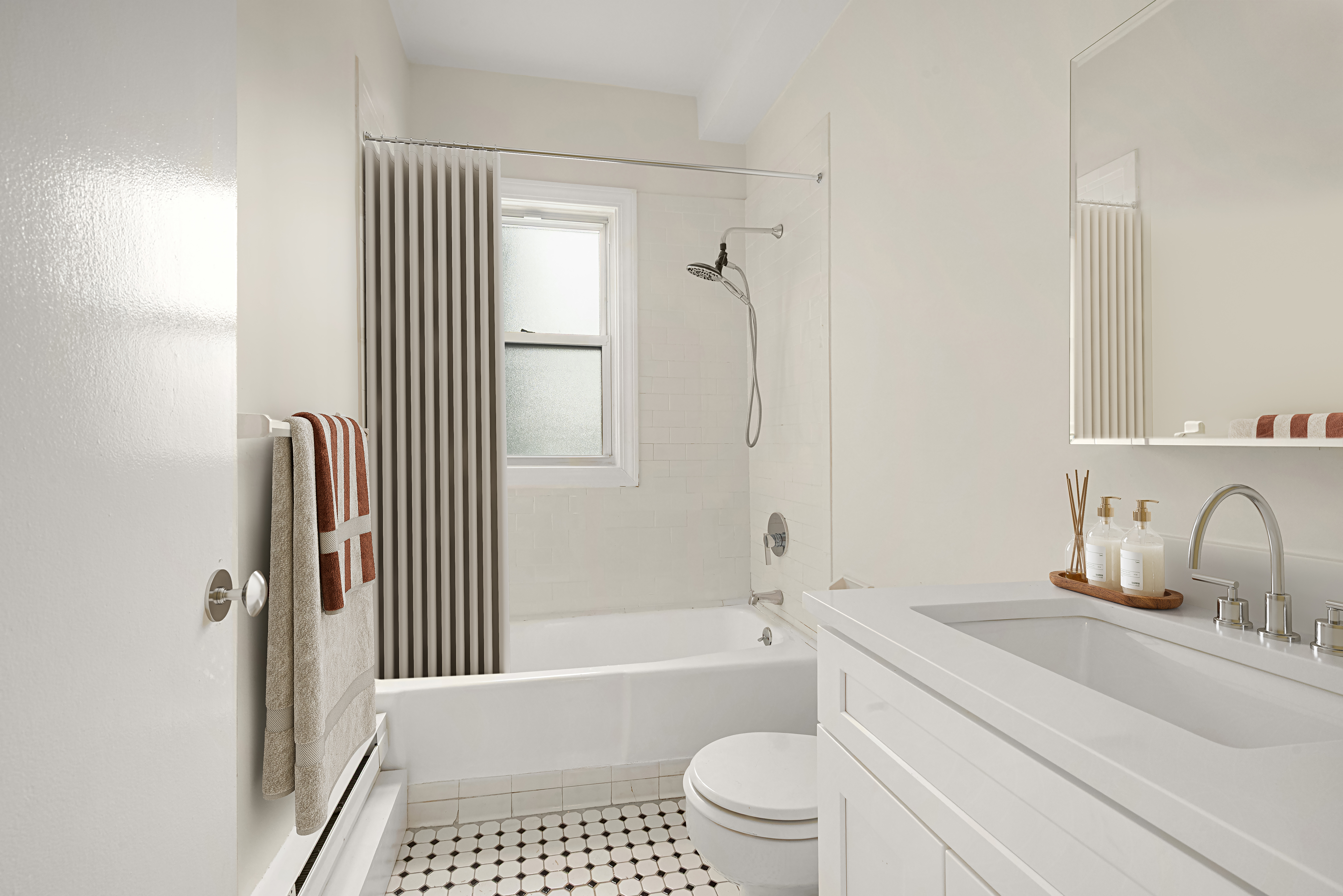 77 Park Avenue, Unit 16G Manhattan, NY 10016 - Photo 6 of 8 a bathroom with a sink toilet and shower