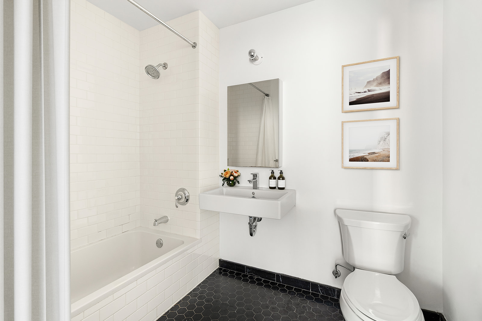 719 6th Avenue, Unit 1 Brooklyn, NY 11215 - Photo 7 of 10 a bathroom with a toilet a sink and bathtub