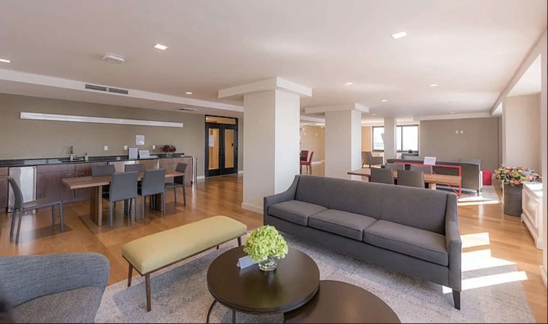 200 Rector Place, Unit 6P Manhattan, NY 10280 - Photo 9 of 10 a living room kitchen with furniture and a view of kitchen