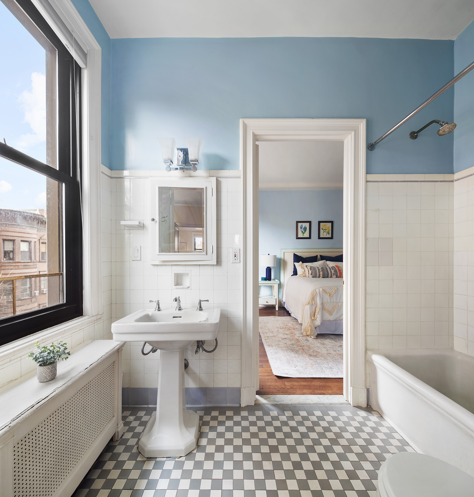 1115 5th Avenue, Unit 5B Manhattan, NY 10128 - Photo 15 of 19 a bathroom with a sink toilet and shower