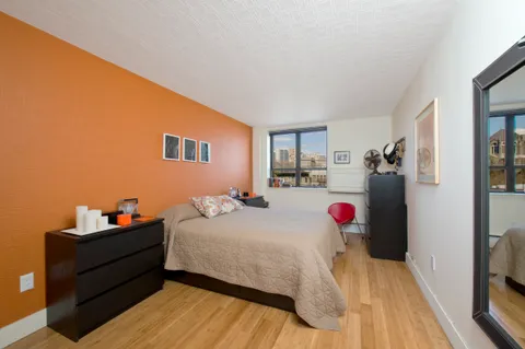 a bedroom with a bed and a closet