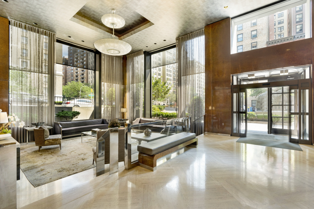 900 Park Avenue, Unit 10B Manhattan, NY 10075 - Photo 9 of 11 a lobby with furniture and floor to ceiling window