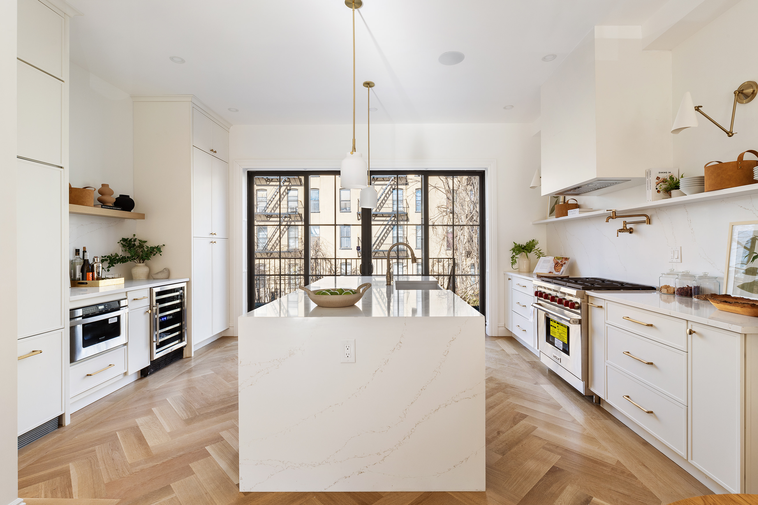 427 Quincy Street Brooklyn, NY 11221 - Photo 4 of 12 a large kitchen with stainless steel appliances granite countertop a stove a sink and a refrigerator