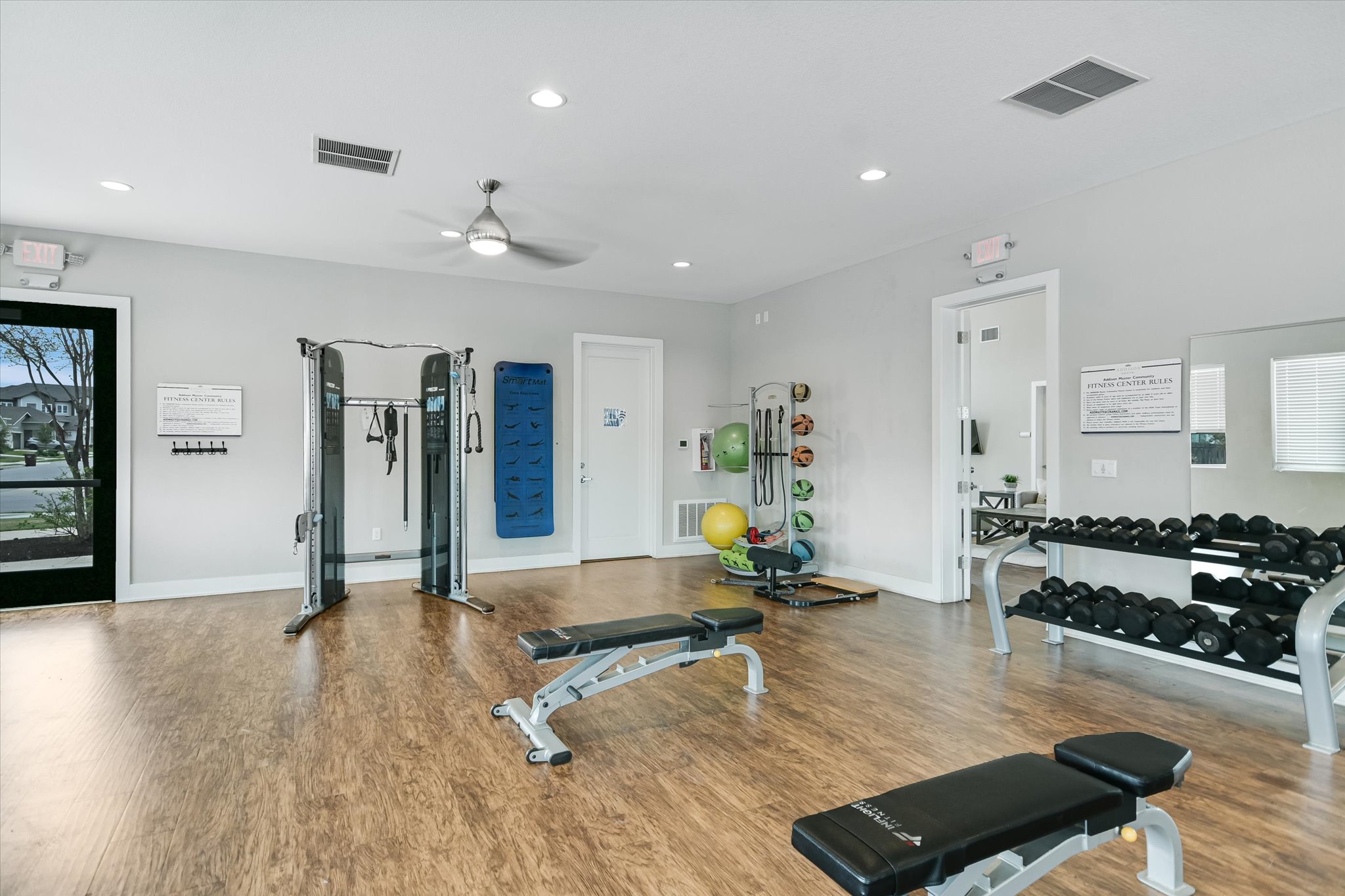 8607 McKamy Drive Austin, TX 78744 - Photo 27 of 28 a living room with kitchen island furniture and a wooden floor