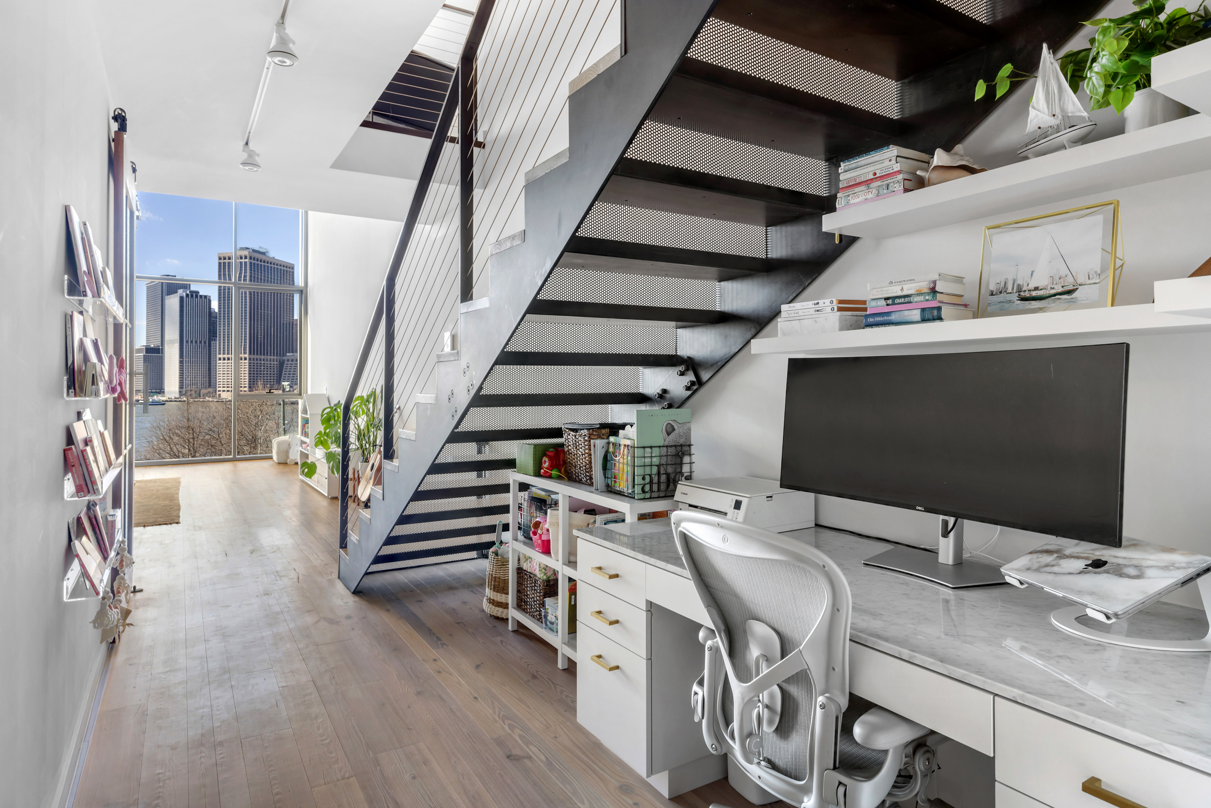 90 Furman Street, Unit N609 Brooklyn, NY 11201 - Photo 12 of 28 a view of a livingroom with furniture and staircase