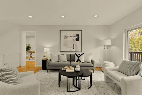 a living room with furniture and a table