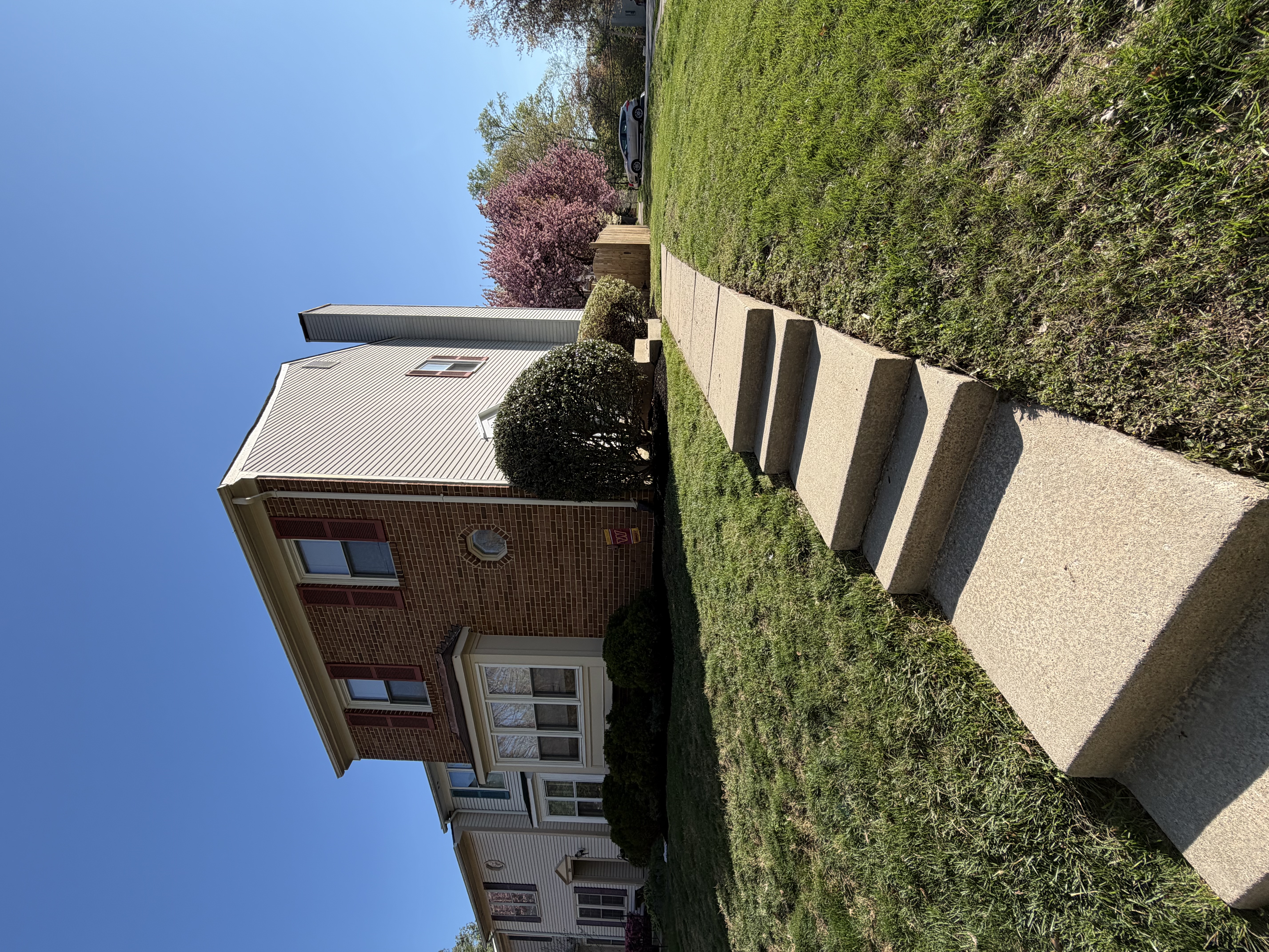 7265 Kousa Lane Springfield, VA 22152 - Photo 6 of 11 a front view of a house with garden