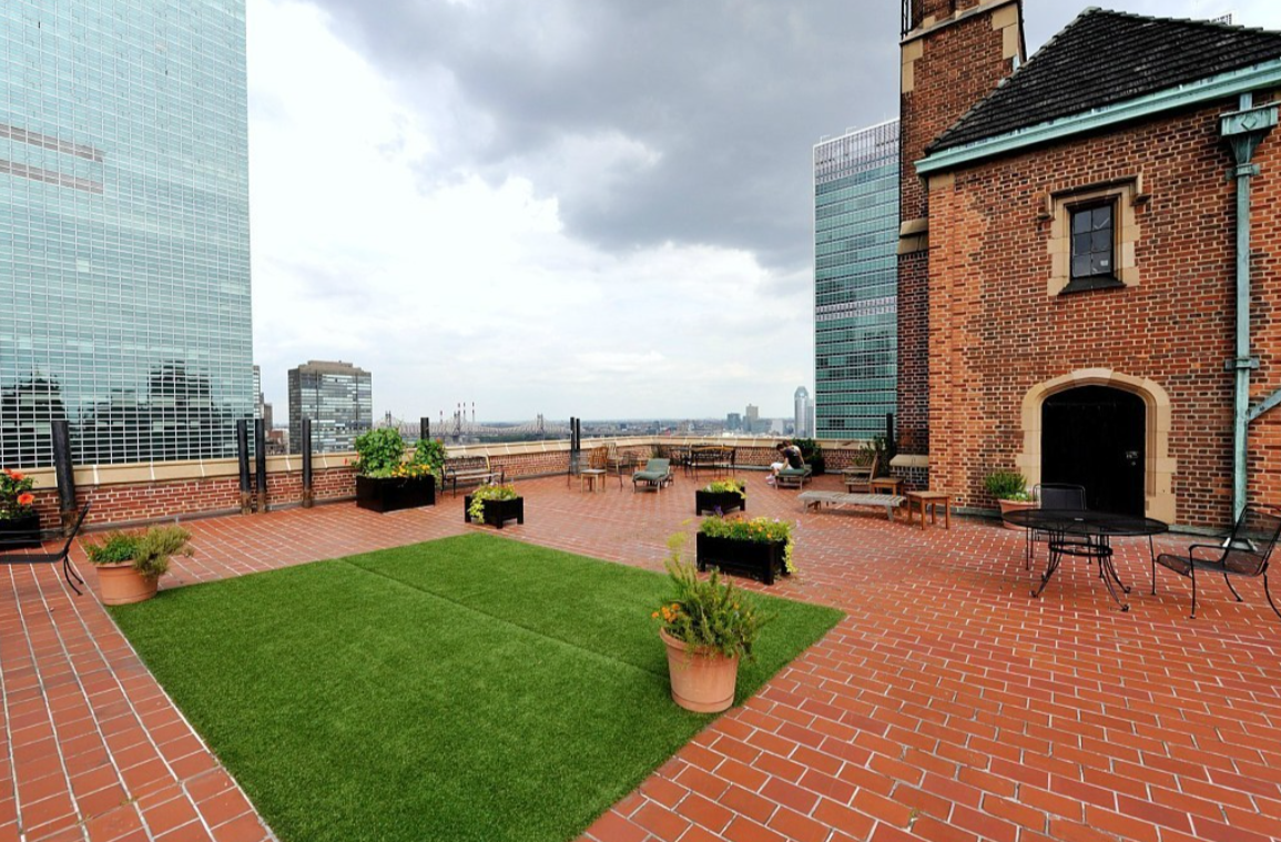 45 Tudor City Place, Unit 1808 Manhattan, NY 10017 - Photo 8 of 10 a view of a patio with swimming pool