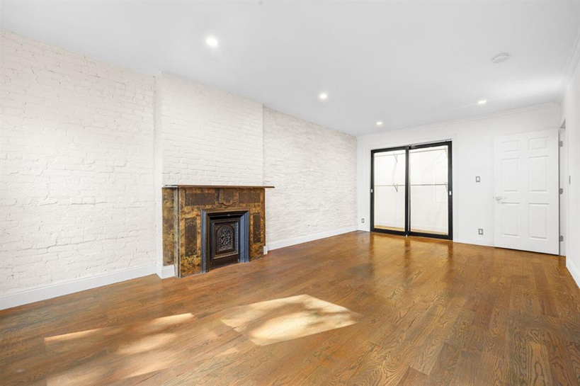 308 Clifton Place Brooklyn, NY 11216 - Photo 12 of 41 a view of empty room with a fireplace