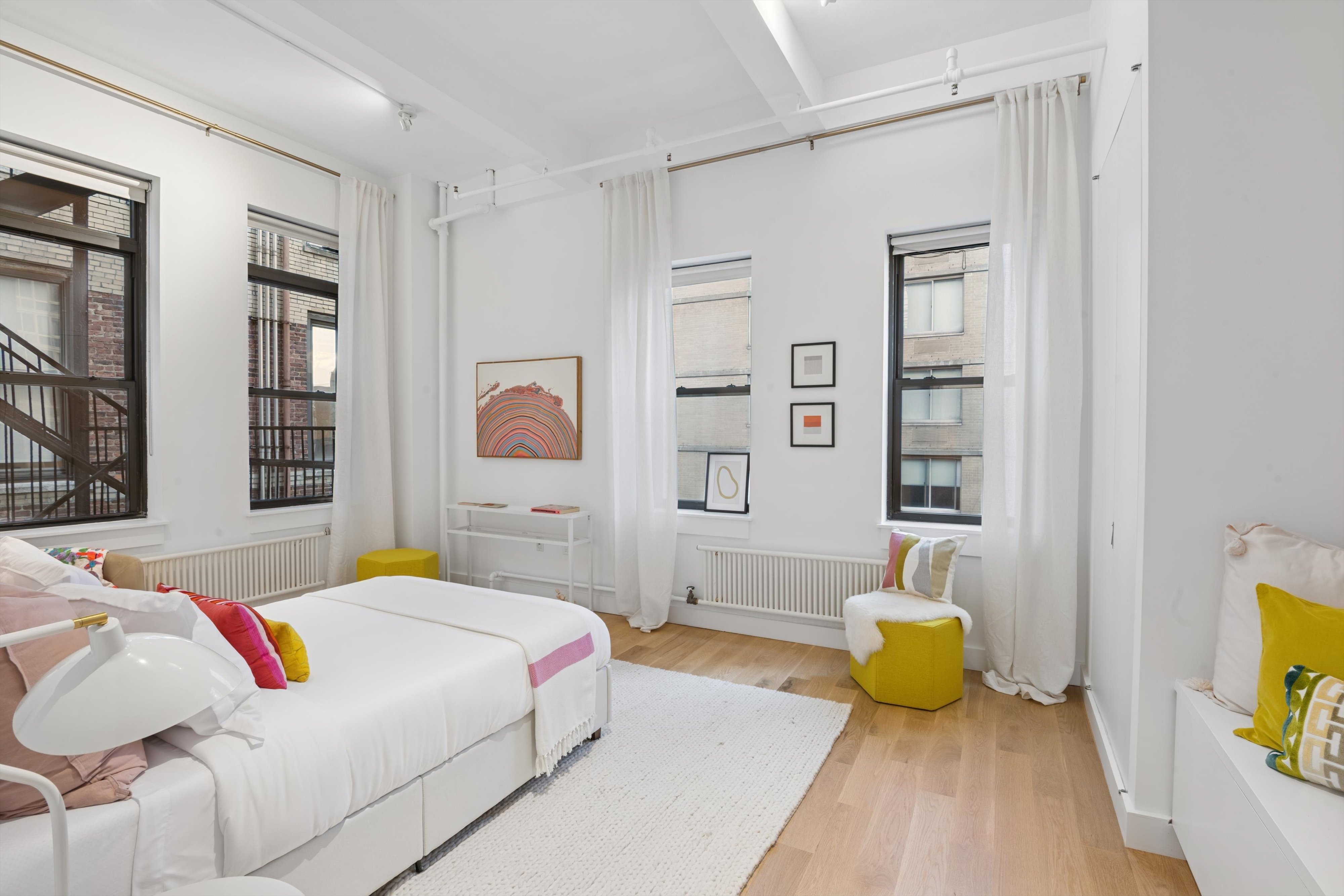 109 West 26th Street, Unit 9 Manhattan, NY 10001 - Photo 15 of 23 a bedroom with a bed and a couch