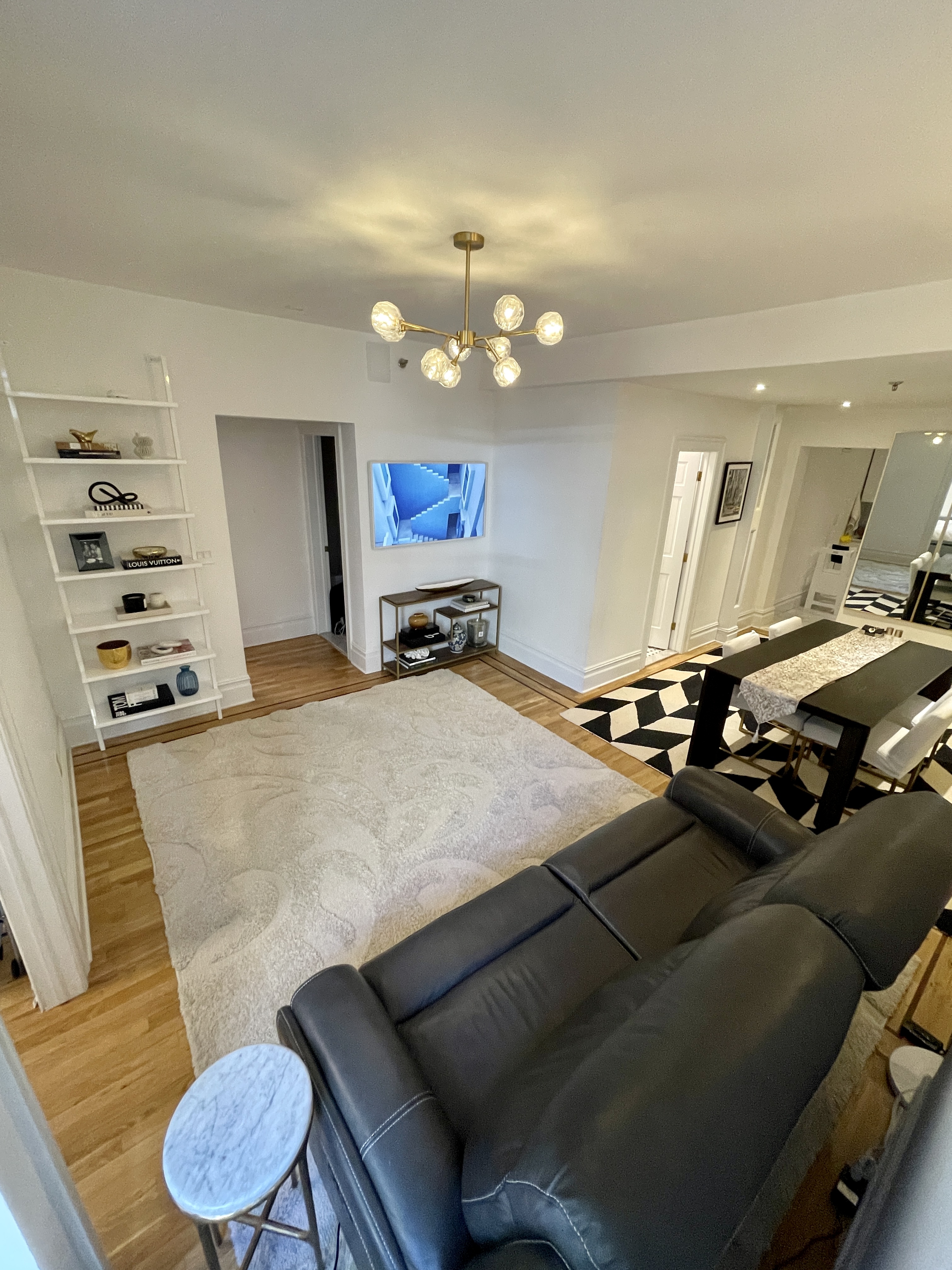 203 West 90th Street, Unit 6B Manhattan, NY 10024 - Photo 3 of 22 a room with furniture and a flat screen tv