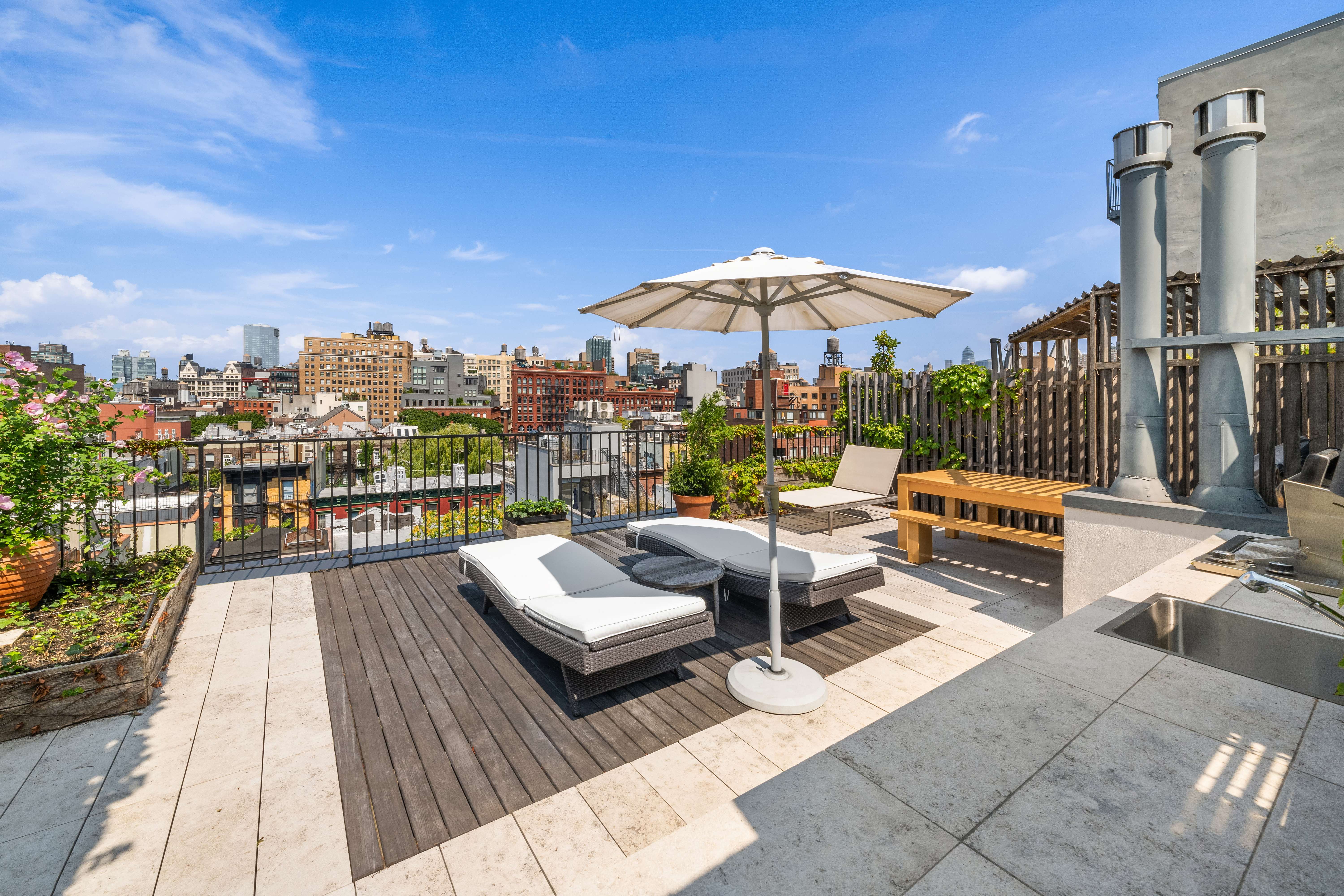 250 Bowery, Unit PHD Manhattan, NY 10012 - Photo 7 of 14 a view of a terrace with couches and pool