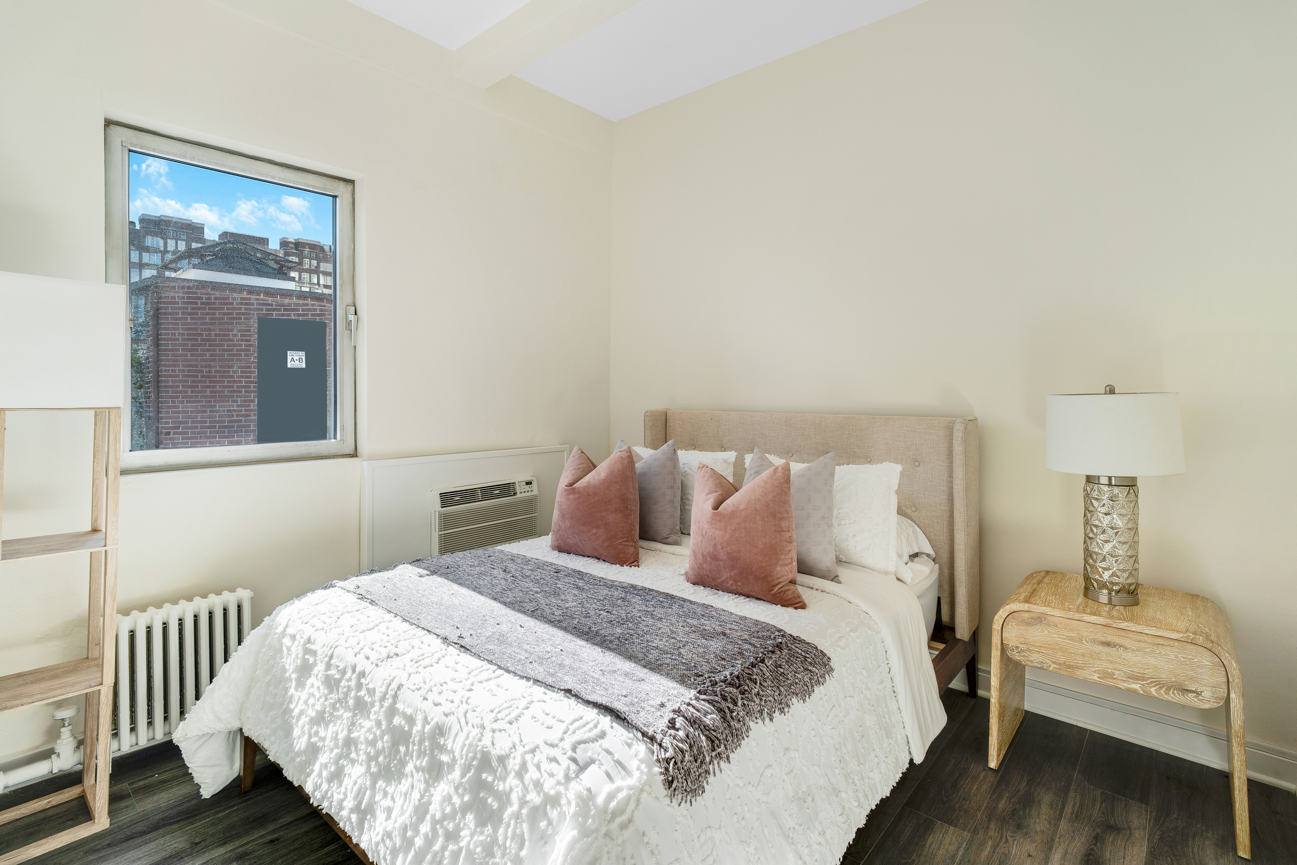 1349 Lexington Avenue, Unit PH2 Manhattan, NY 10128 - Photo 10 of 18 a bedroom with a bed and wooden floor