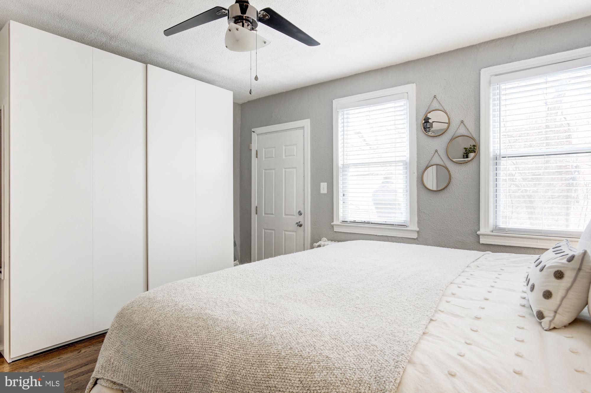 731 13th Street Northeast Washington, DC 20002 - Photo 23 of 43 a bedroom with a large bed and a window