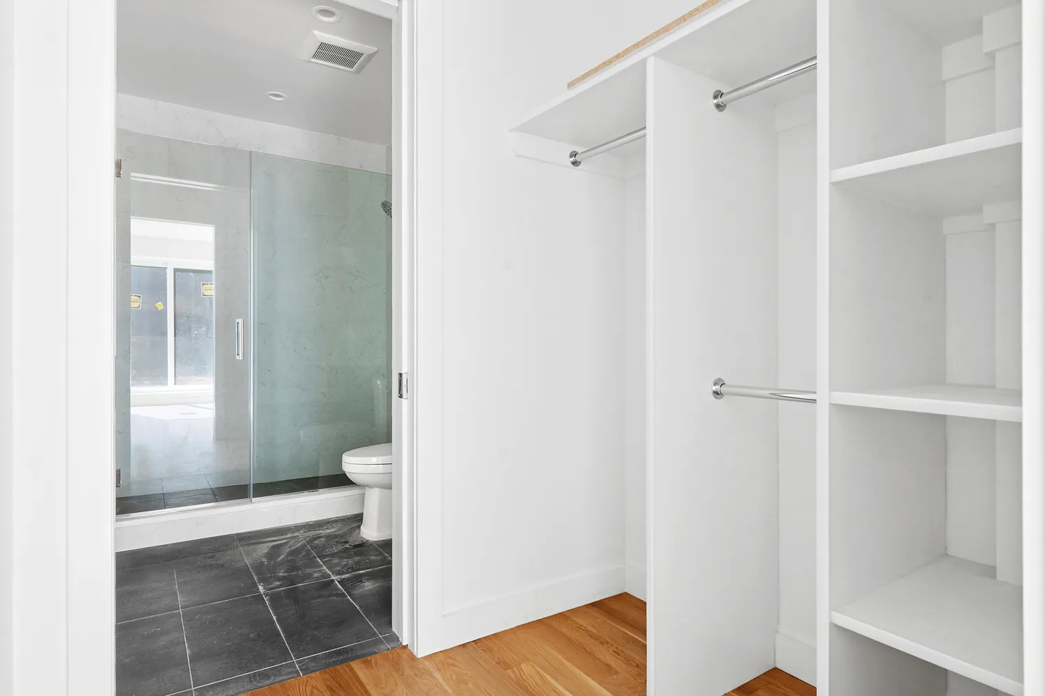 a bathroom with a shower and toilet