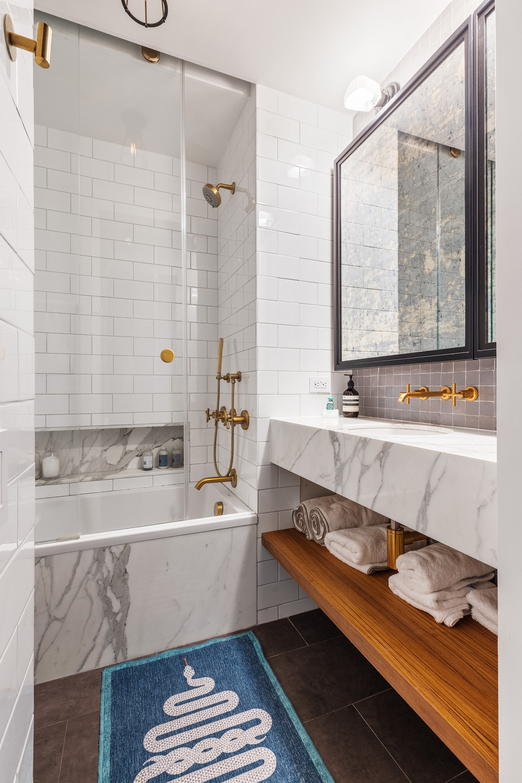525 West 22nd Street, Unit 4B Manhattan, NY 10011 - Photo 12 of 13 a bathroom with a bathtub and a sink