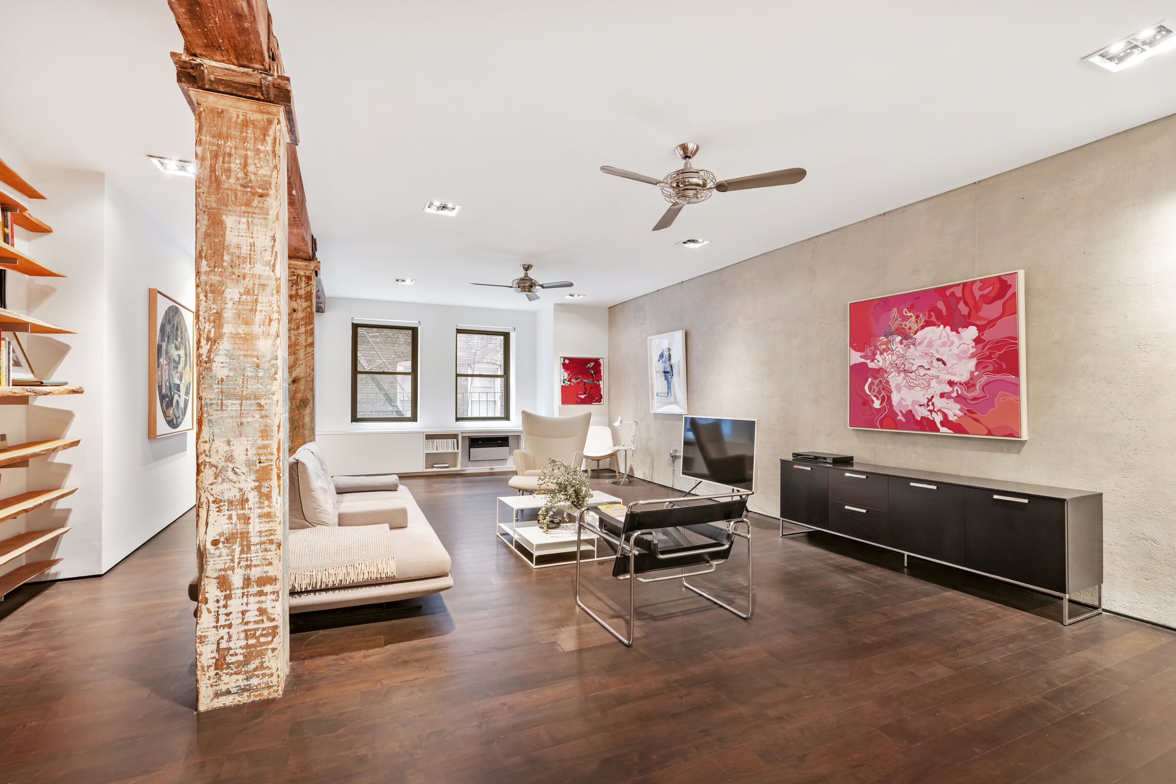 250 West 27th Street, Unit 3A Manhattan, NY 10001 - Photo 1 of 15 a living room with furniture and a flat screen tv