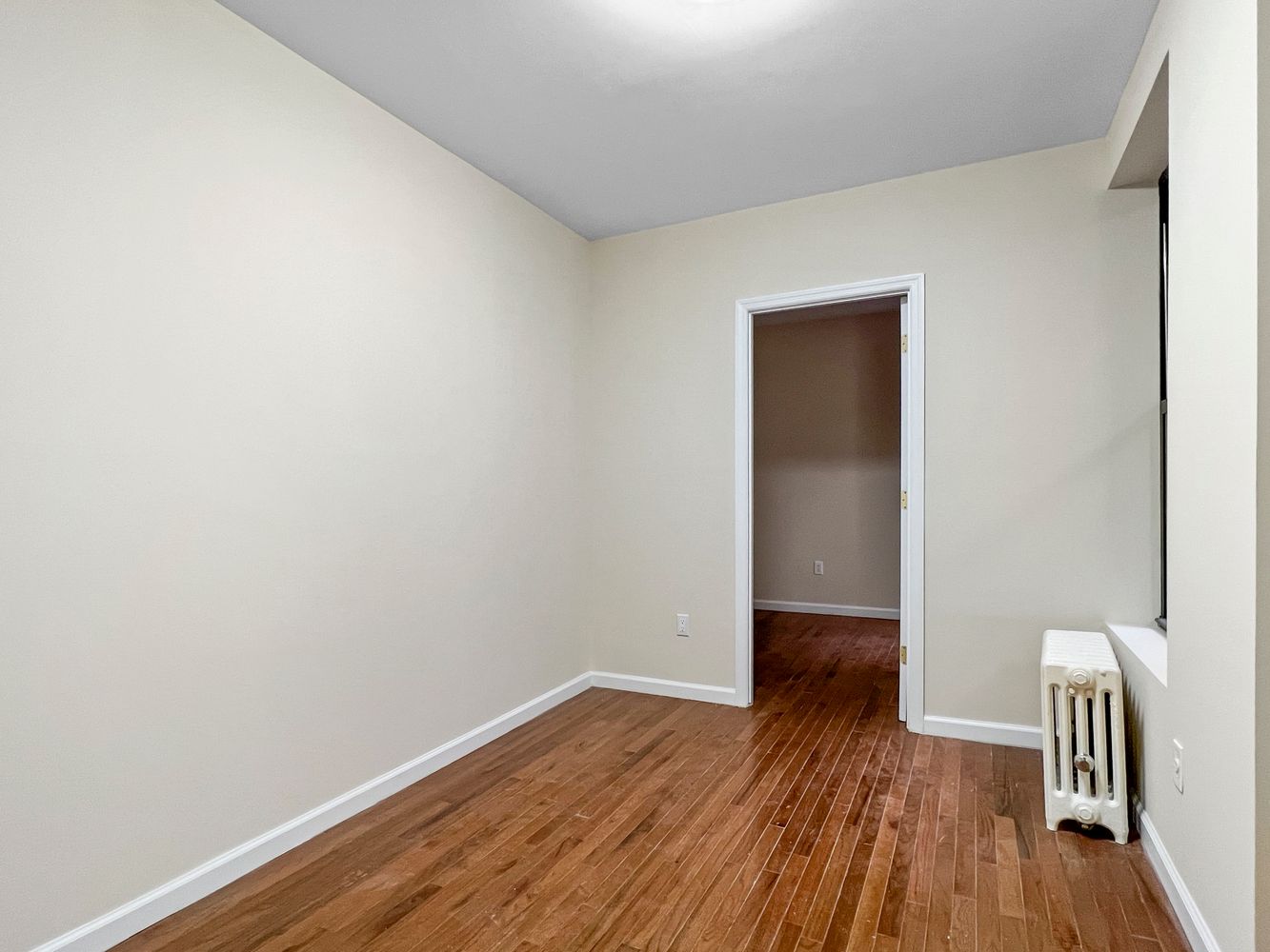 270 East 78th Street, Unit 1 Manhattan, NY 10075 - Photo 2 of 6 a view of room with wooden floor