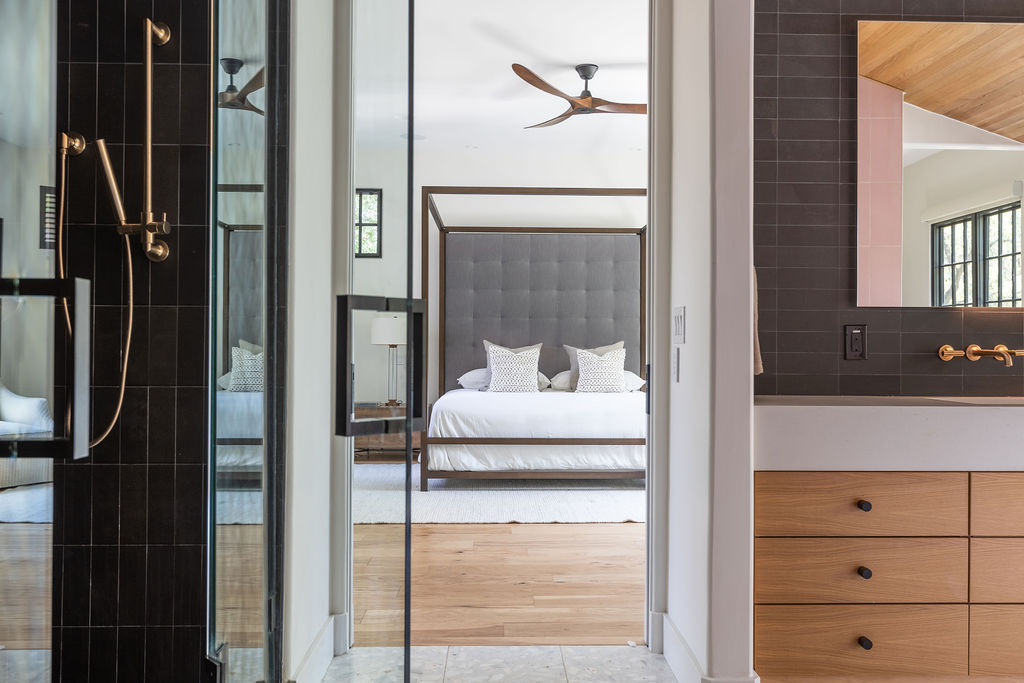 400 Inwood Road Austin, TX 78746 - Photo 27 of 43 a en suite bathroom with a granite countertop sink and a mirror