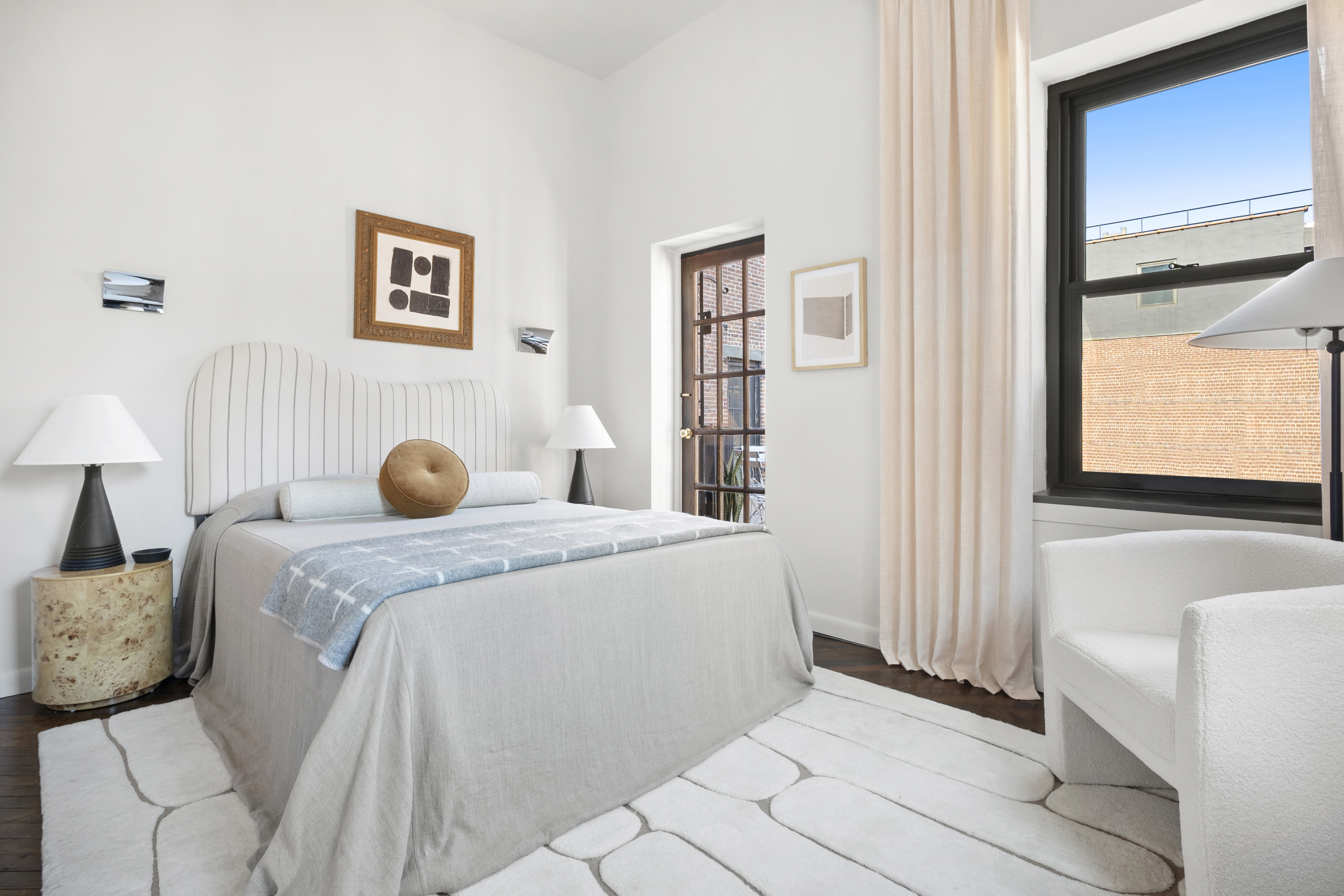 454 West 46th Street, Unit 5CS Manhattan, NY 10036 - Photo 7 of 25 a bedroom with a bed and a window