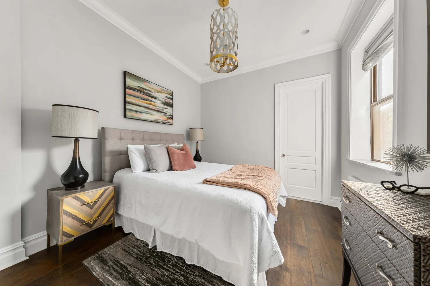 a bedroom with bed and a window