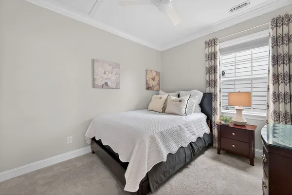 a bed room with a bed and a lamp