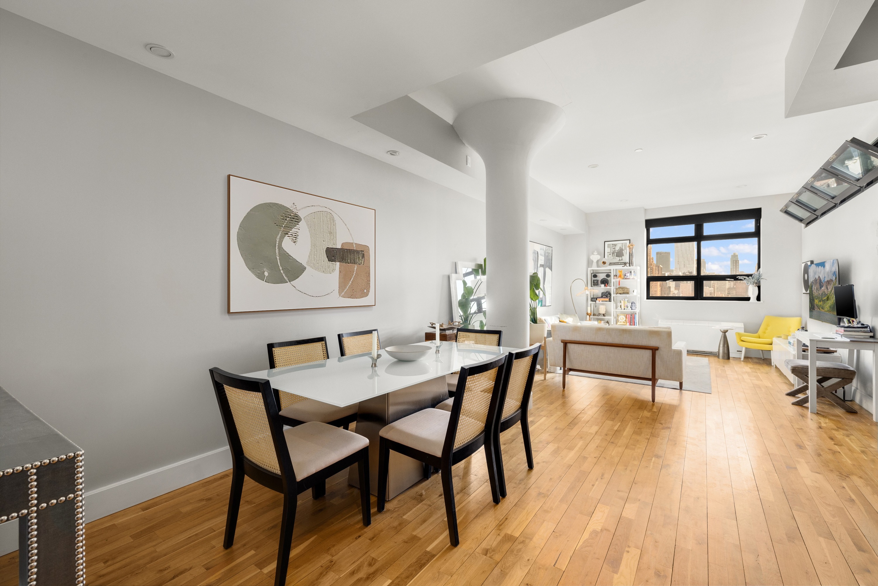 360 Furman Street, Unit 1110 Brooklyn, NY 11201 - Photo 2 of 23 a view of a dining room with furniture and wooden floor
