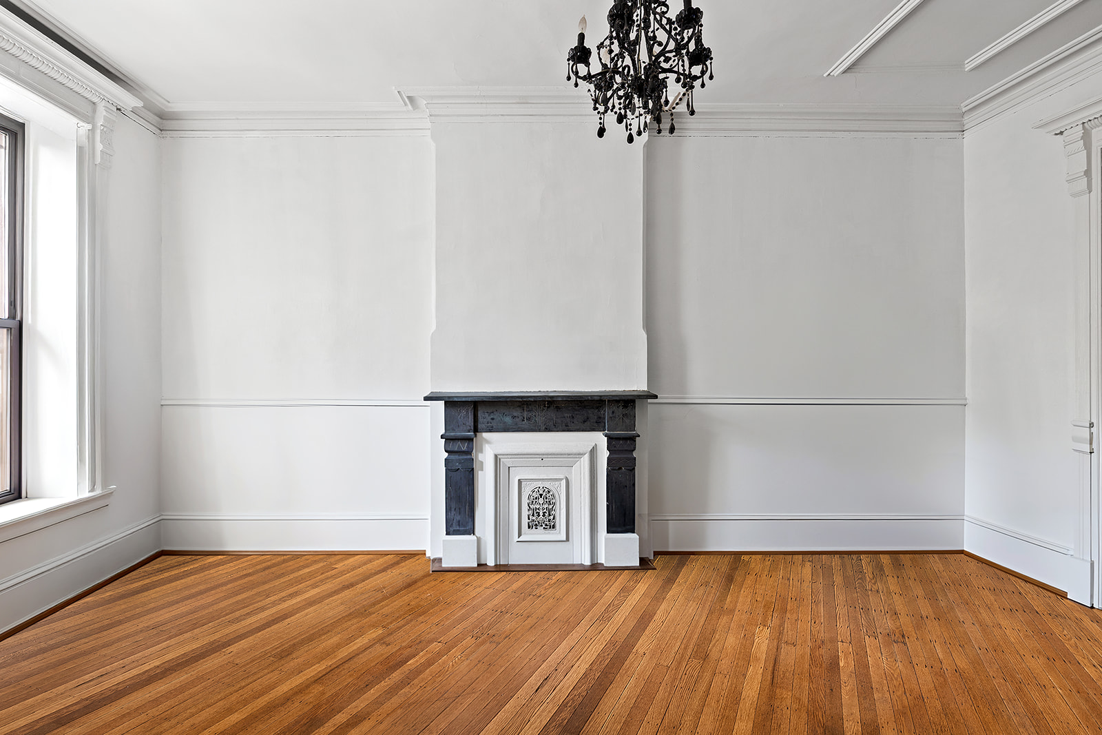 441 MacDonough Street Brooklyn, NY 11233 - Photo 2 of 13 a view of a room with a ceiling fan and wooden floor