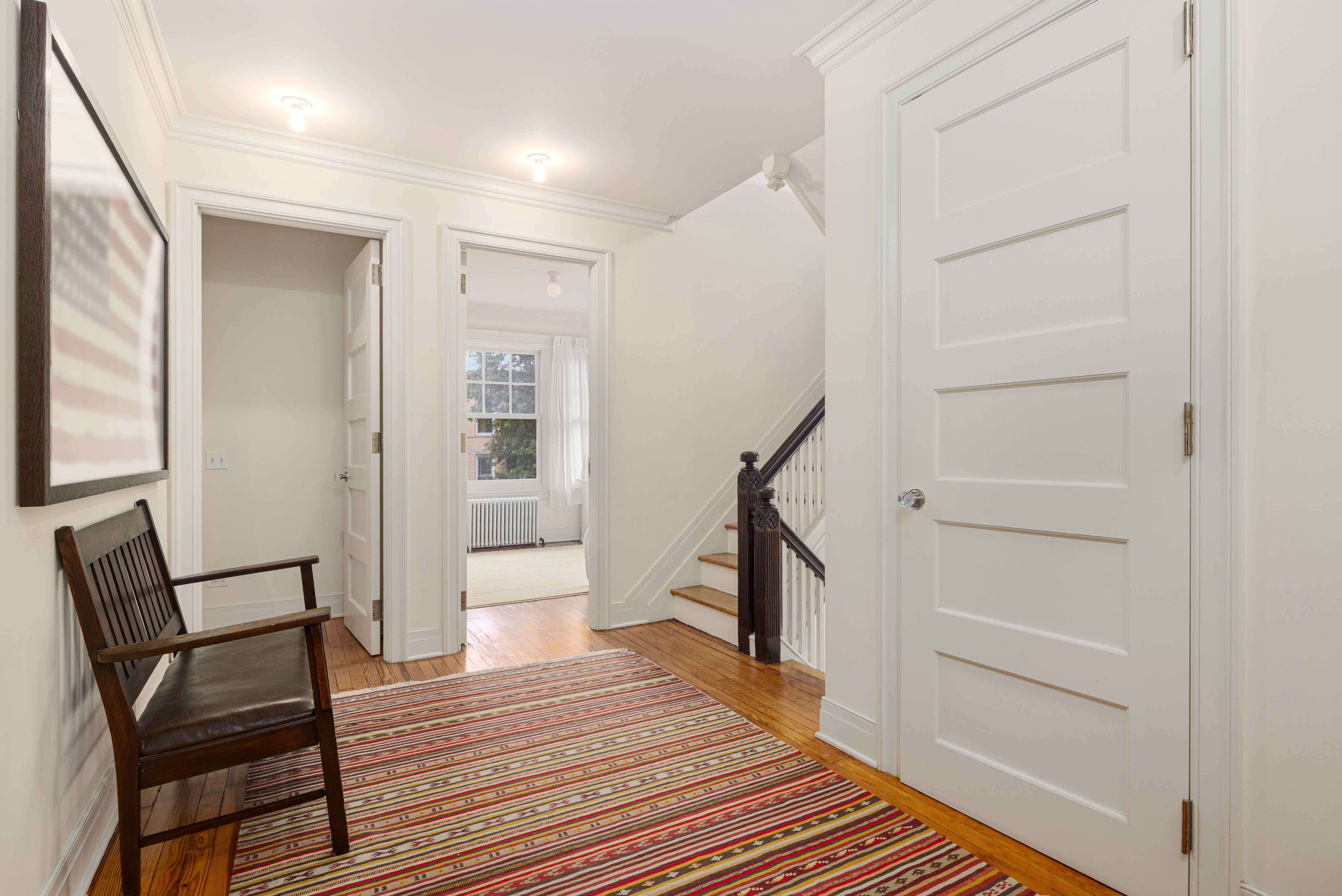 200 Fenimore Street Brooklyn, NY 11225 - Photo 17 of 24 a view of a hallway with wooden floor and staircase
