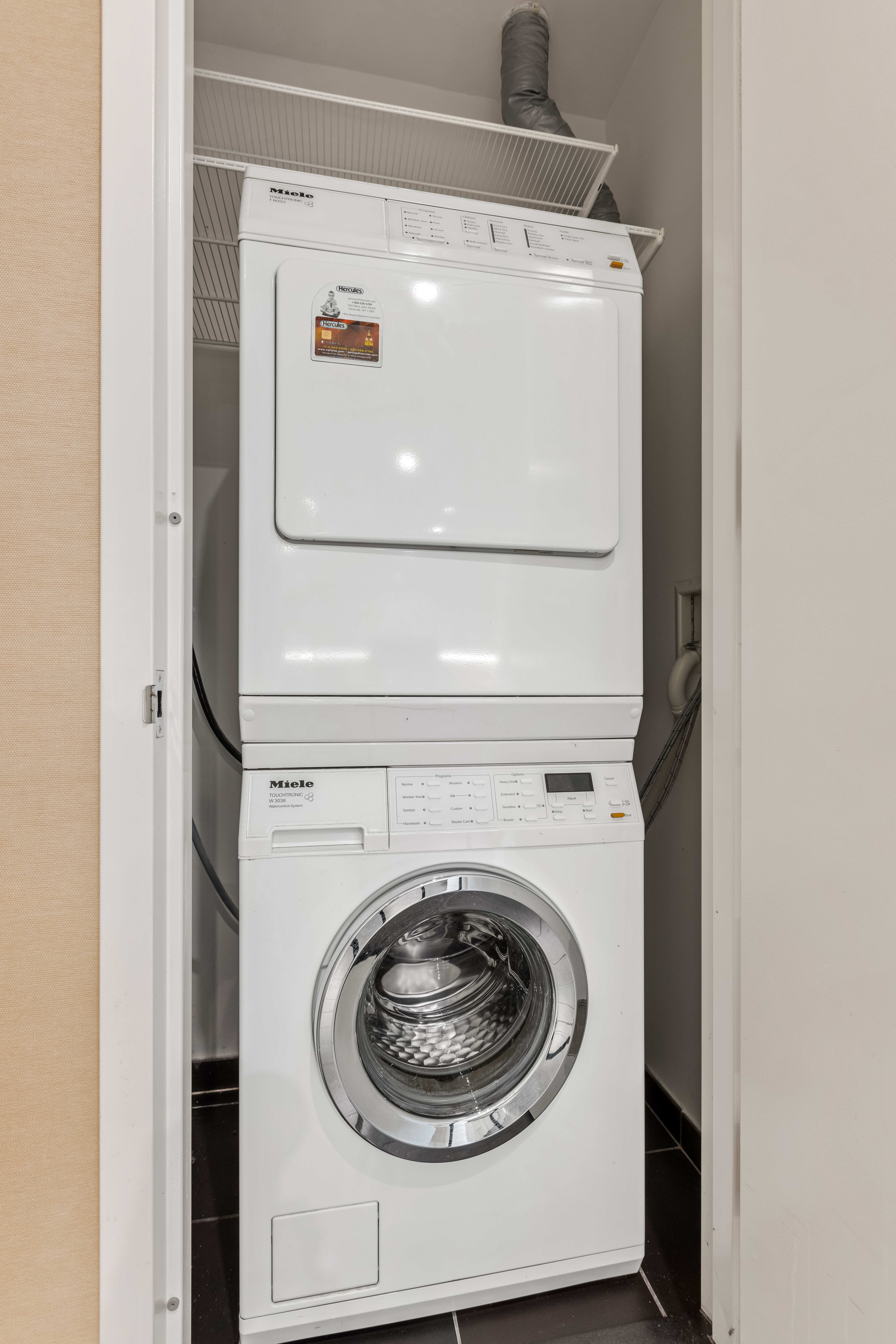 50 Riverside Boulevard, Unit 19F Manhattan, NY 10069 - Photo 15 of 24 a utility room with dryer and washer