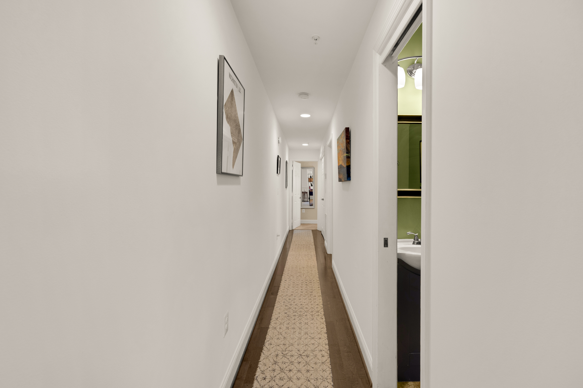 233 S Street Northeast, Unit 4 Washington, DC 20002 - Photo 17 of 37 a view of a hallway with wooden floor and staircase