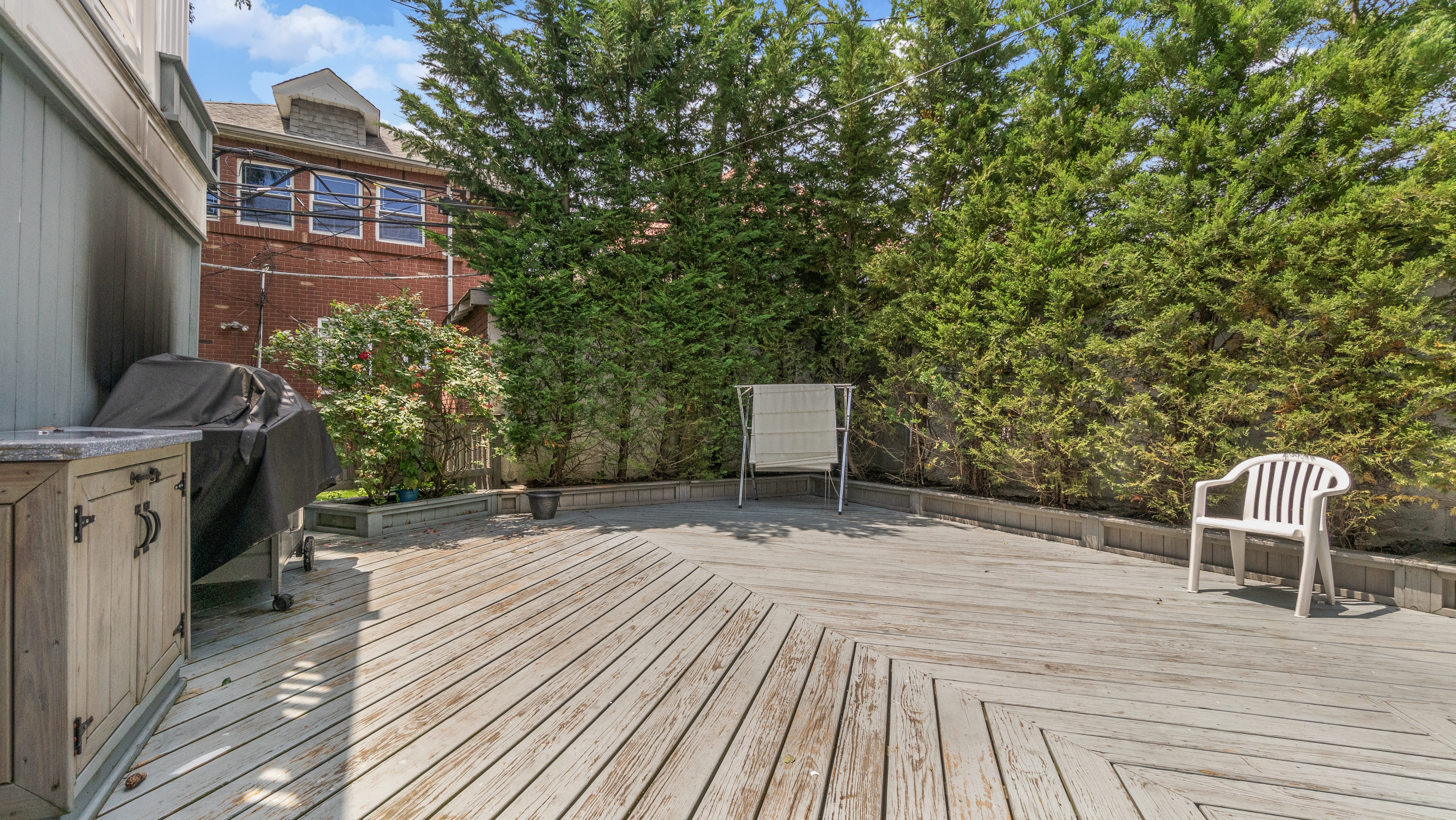 278 Amherst Street Brooklyn, NY 11235 - Photo 13 of 24 a backyard of a house with table and chairs