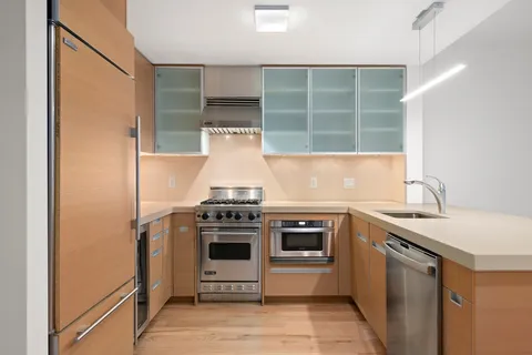 a kitchen with a stove and a sink