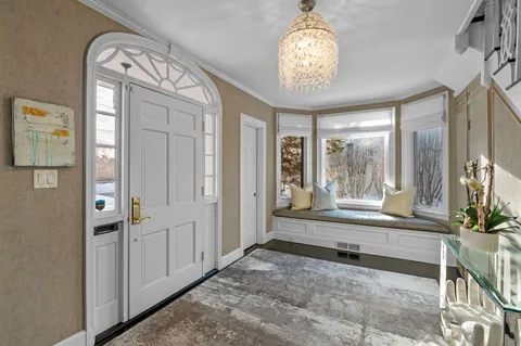 a spacious bathroom with a large tub and shower