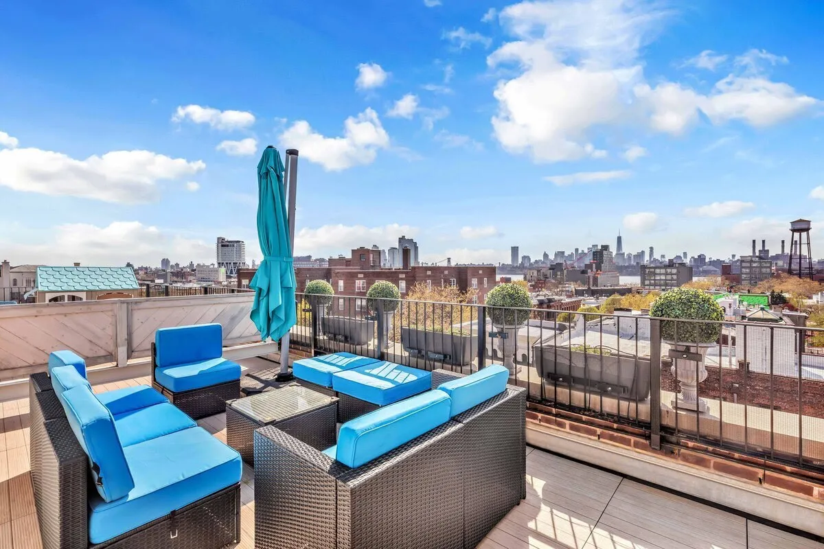 a view of a terrace with furniture