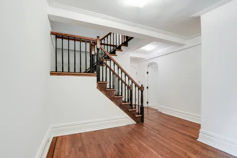 a view of entryway with wooden floor