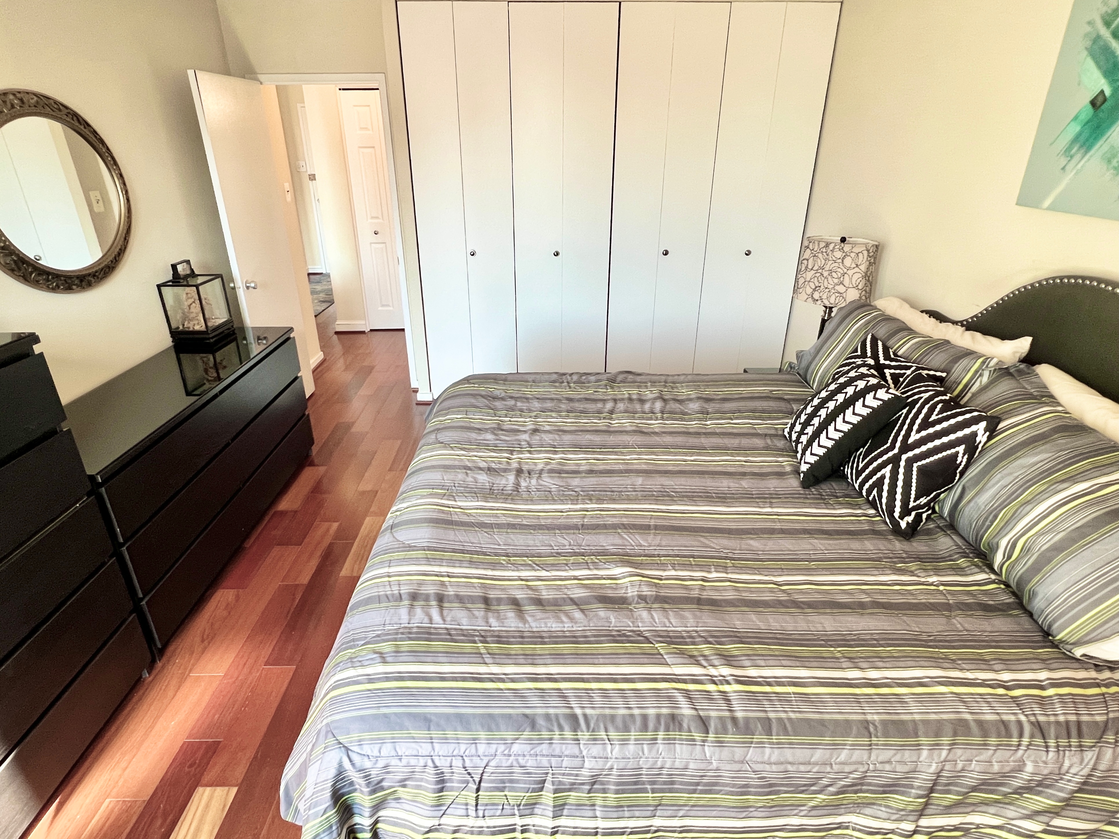 490 M Street Southwest, Unit W304 Washington, DC 20024 - Photo 18 of 36 a bed sitting in a bedroom next to a window