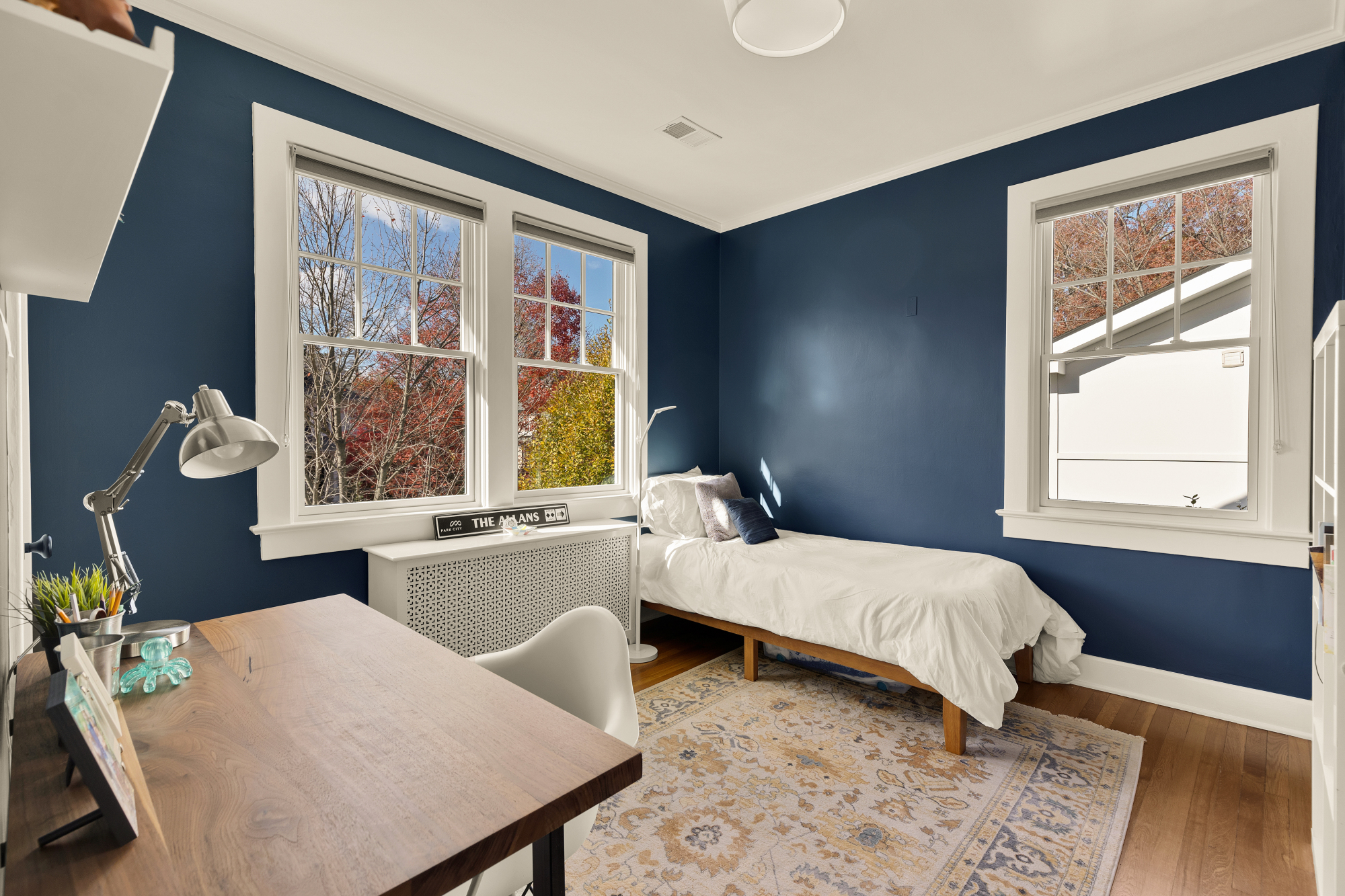 6815 Delaware Street Chevy Chase, MD 20815 - Photo 16 of 34 a bedroom with a bed and wooden floor